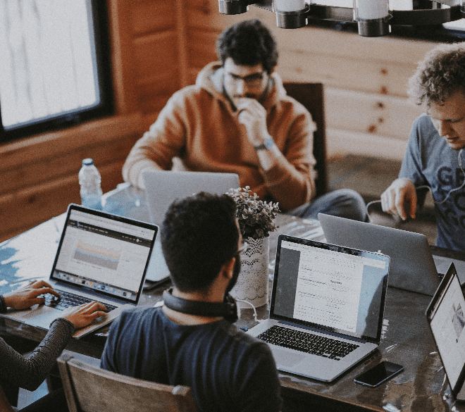 A team working together at shared tables